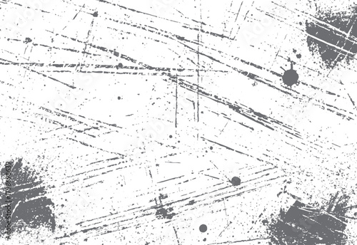 Abstract distressed grunge background with random gray scratches and splatters on white surface texture