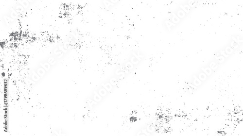 Abstract textured background with scattered gray speckles and irregular shapes on white grunge noise