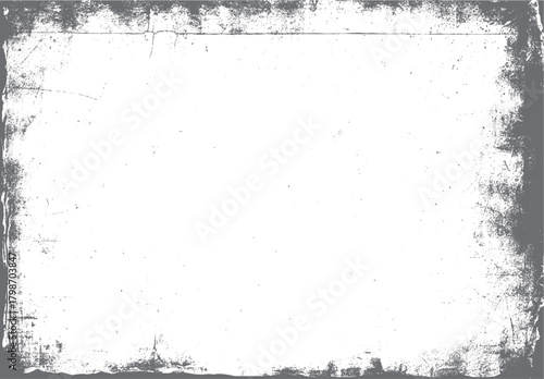 Grungy distressed textured border with subtle scratches and dust specks on a white background grunge