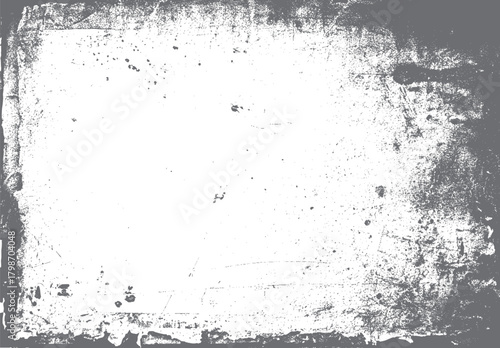 Grungy distressed texture overlay with scattered speckles and rough edges in grayscale tones grunge background