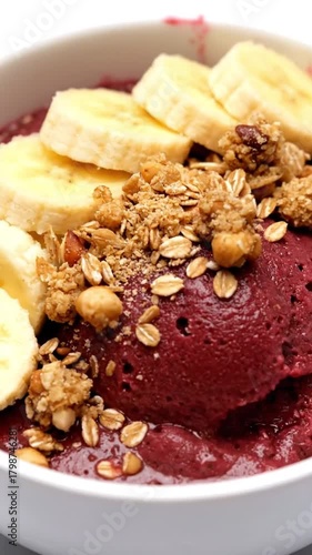 Traditional Brazilian açaí bowl served with granola and banana slices