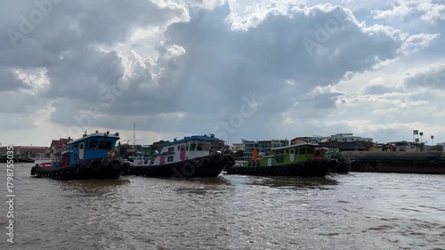Three Tugboats Pull Sand Barge that Riding on Chao Phraya River, Bangkok, Thailand