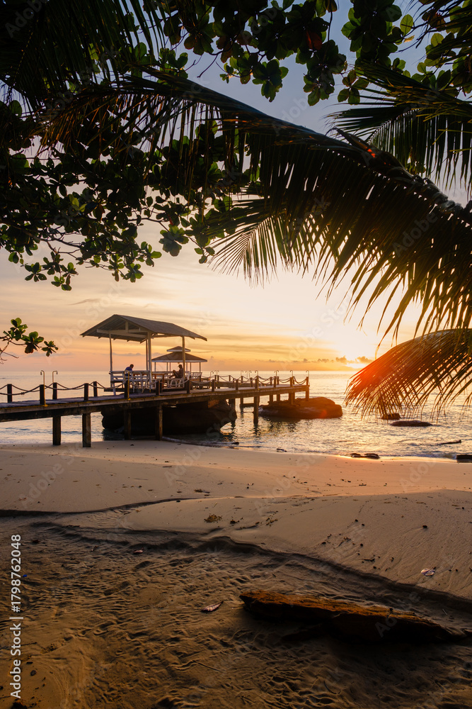 Fototapeta premium Breathtaking sunset view at Koh Kood Island, Thailand with serene beachside ambiance