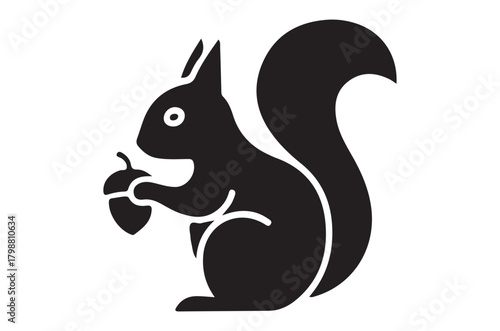 A simple black and white illustration of a squirrel holding an acorn, rabbit silhouette
