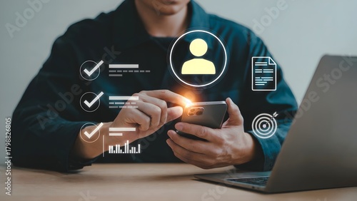 A person interacting with a glowing digital interface showing user profile icons checkmarks documents and progress bars in a modern workspace