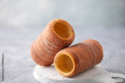 Czech trdelnik or Hungarian kurtosh kalach. Roasted pastries with sugar and cinnamon