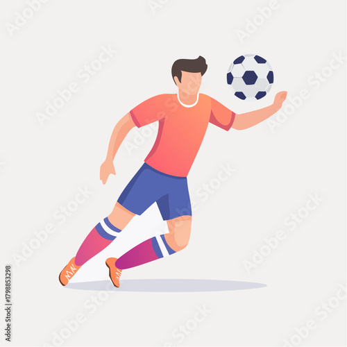 A male soccer player in a red shirt and blue shorts running with a football.