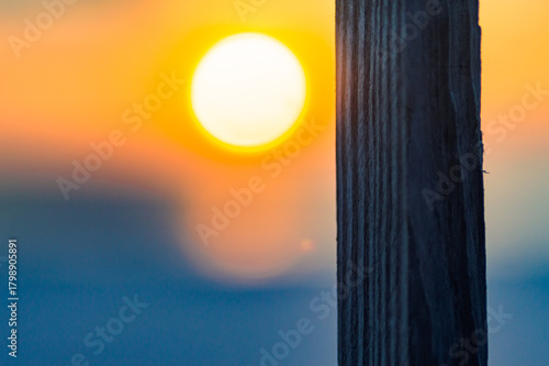 sunset with fence post