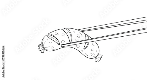 A close up of a cooked sausage being held by chopsticks.