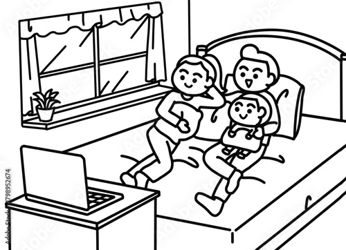 The family watches movies online together at night.