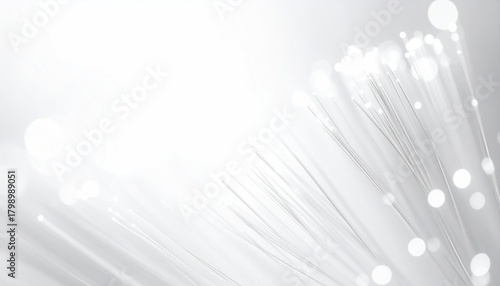 Soft, white background with a cluster of illuminated strands. Subtle bokeh effects add a sense of ethereal light and movement