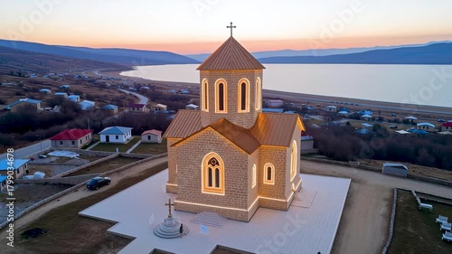 Sacred Serenity: A majestic church stands proudly, silhouetted against a serene twilight sky and overlooking a calm lake, offering a sense of peace and tranquility.