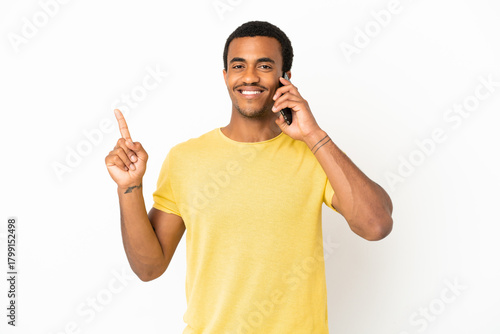 African American handsome man using mobile phone over isolated white background showing and lifting a finger in sign of the best