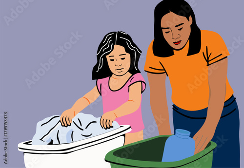 Mother Teaching Daughter Laundry Chores at Home