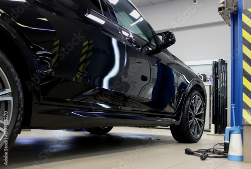 A cleaned service bay with a vehicle ready to be lifted onto a lift for inspection of components and assemblies
