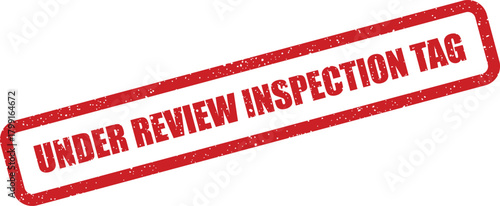 Grunge textured stamp impression featuring an inspection tag currently under official review process