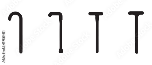 Set of four walking sticks, different styles for mobility aid.