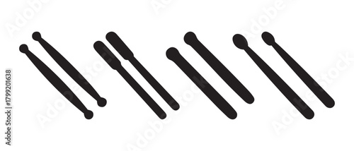 Various drumsticks and mallets for percussion musical instruments.