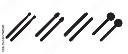 Various drumsticks and mallets for percussion musical instruments.
