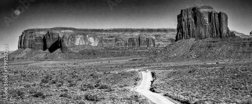 Monument Valley desert landscape captured in monochrome highlighting textures and shadows of rocks