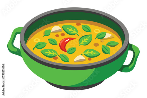 Green bowl filled with flavorful yellow soup, aromatic basil leaves, and spicy red chili