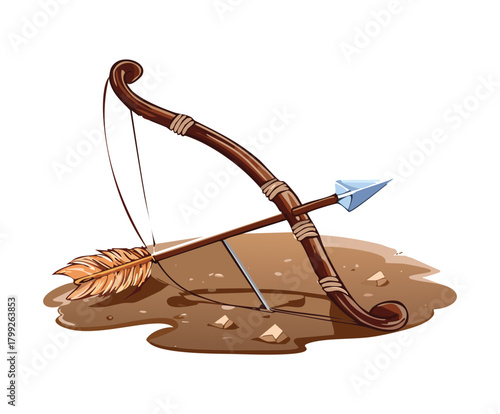 Ancient weathered wooden bow and arrow lying on a dirt mound with feathers for primitive survival theme