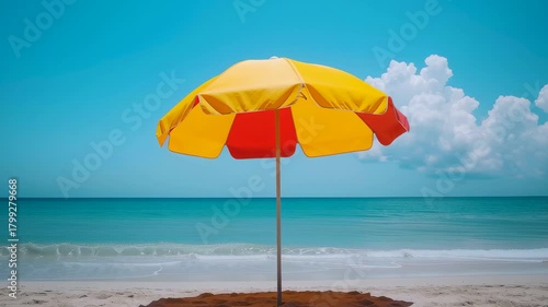 Sun Umbrella by the Beach: A vibrant sun umbrella stands against the clear turquoise sea and sky, the epitome of a perfect day on a peaceful, sandy beach.