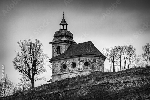 
old abandoned church on a bare hill