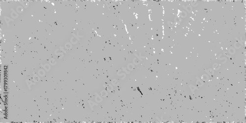 Abstract textured background with a distressed grunge effect and scattered speckles