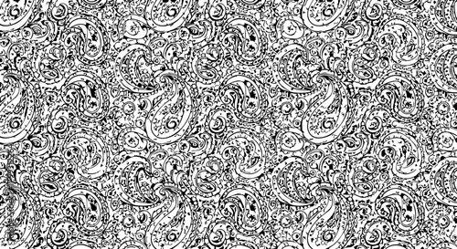 Intricate black and white paisley pattern design, classic ethnic motif, perfect for textiles and decorative backgrounds, elegant and timeless.