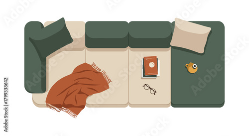 top view modern sectional sofa with cozy blanket books glasses and coffee cup illustrating a relaxing home interior for lifestyle content.