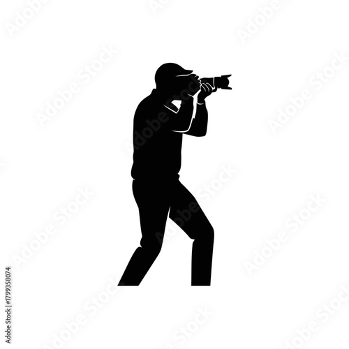 Black silhouette of a male photographer holding a professional camera with a large lens, isolated on a white background.
