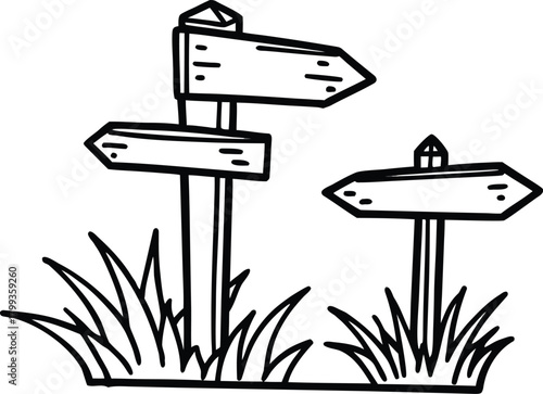 Wooden signpost with blank signs indicating different directions in grass