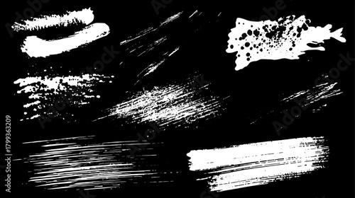 Abstract splash and stroke brush patterns in white on a black background. This vector illustration features unique textures and effects, enhancing visual interest.