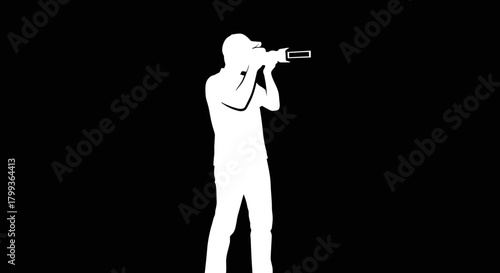 Silhouette of a person holding a camera and taking a picture against a black background.