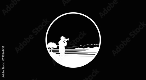 Silhouette of a photographer capturing a scenic landscape within a circular frame.