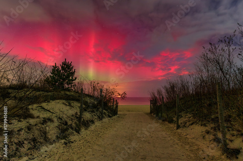 Fototapeta Naklejka Na Ścianę i Meble -  Aurora over the Baltic Sea beach by the Sobieszewo Island, Gdansk. Poland.