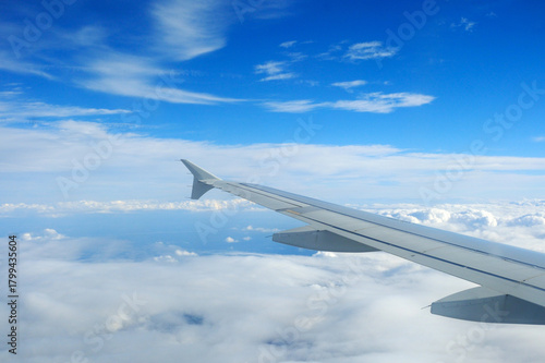 Airbus A320 wing and clouds during the cruise