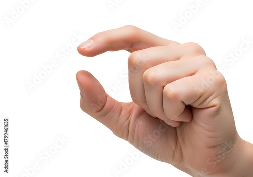 Close up of a Caucasian person's hand showing a small size gesture with thumb and index finger pinched together against a black background with soft lighting and detailed skin texture