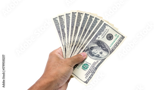 Financial Holding: A hand firmly grasps a fanned stack of United States one-hundred dollar bills, symbolizing wealth, financial stability, and monetary power.