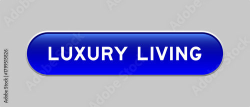 Foto Blue color capsule shape button with word luxury living on gray background