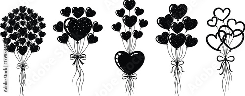 Black heart shaped balloons with white speckles tied with bows vector