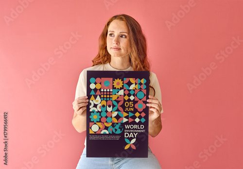 Holding vertical A3 poster