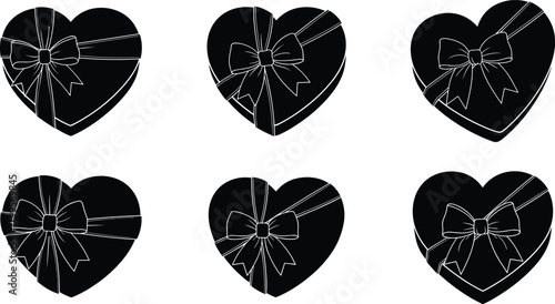 Six black heart shaped gift boxes with white ribbon bows present