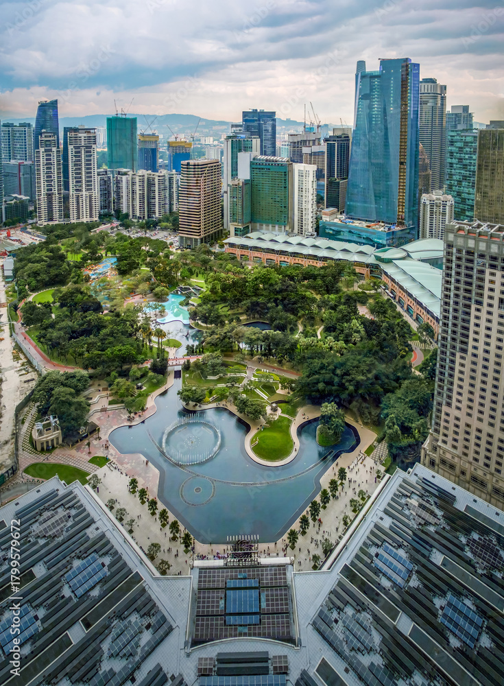 Fototapeta premium Aerial view of KLCC Park, Kuala Lumpur, Malaysia, with dramatic sky at