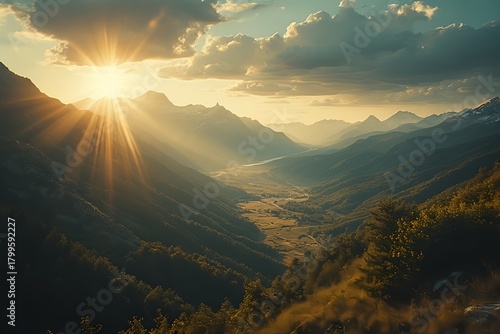 Golden sunbeams pierce through dramatic clouds over a serene mountain valley