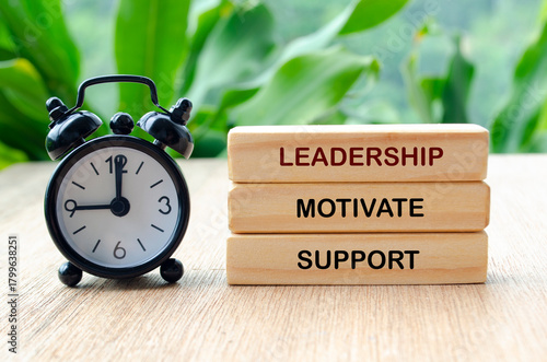 Leadership, motivate and support text on wooden blocks. Leadership concept.