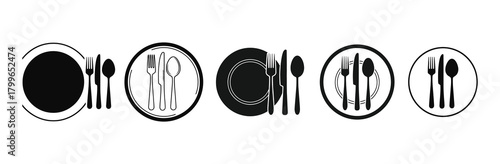 Set table with plates and cutlery in black and white stylized design