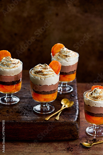 Chocolate Orange Layered Trifle Dessert with Whipped Cream in Glasses