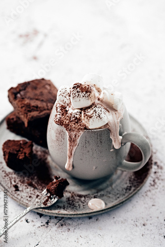 Hot Chocolate with Marshmallows and Brownies on Rustic Plate